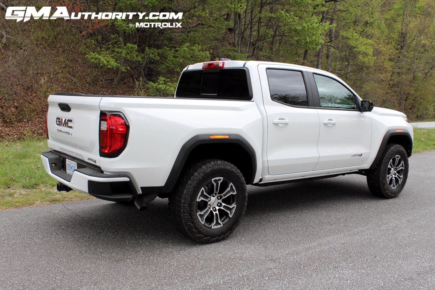 2023-gmc-canyon-at4-summit-white-gaz-first-drive-exterior-016-side-rear-three-quarters