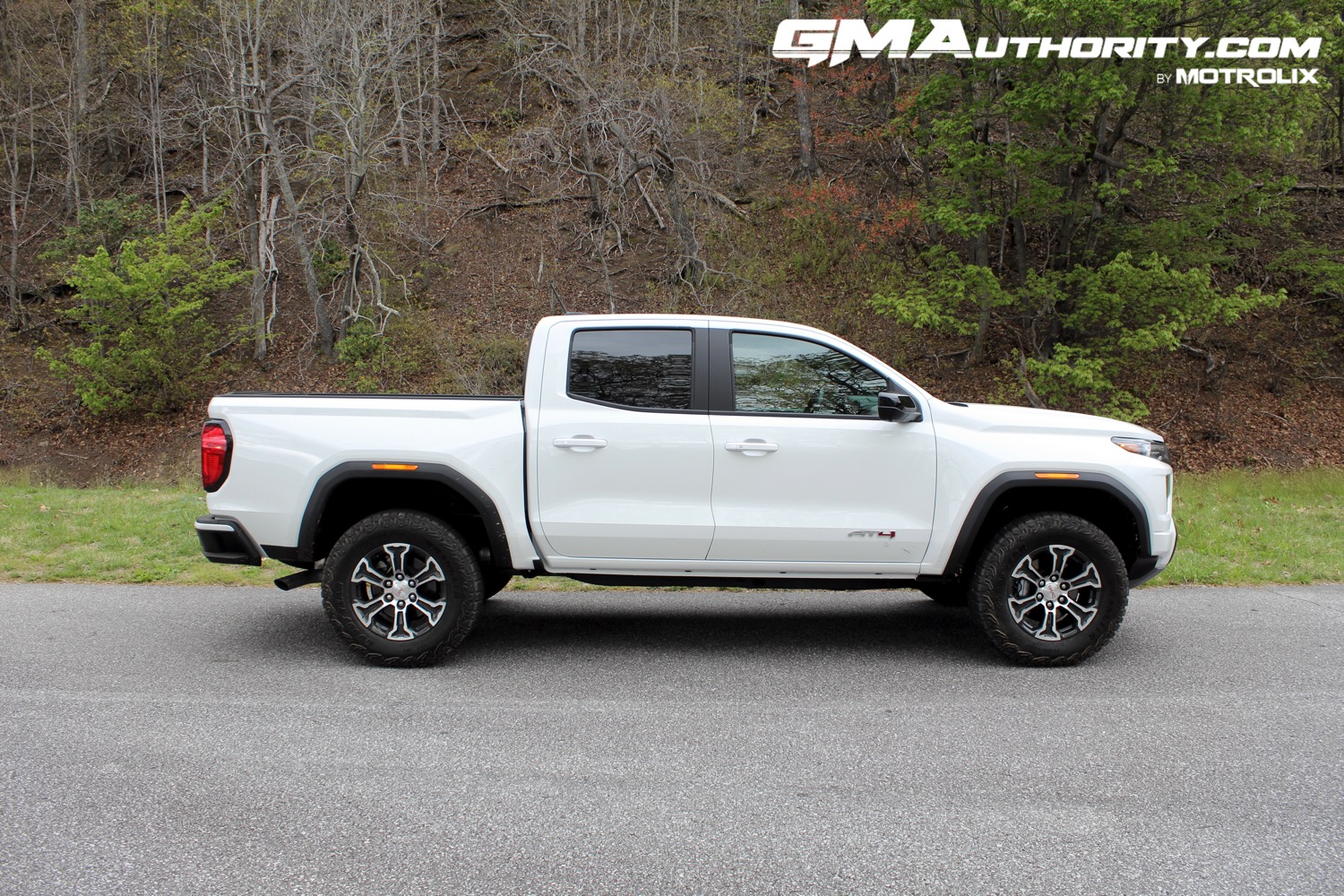 2023-gmc-canyon-at4-summit-white-gaz-first-drive-exterior-017-side