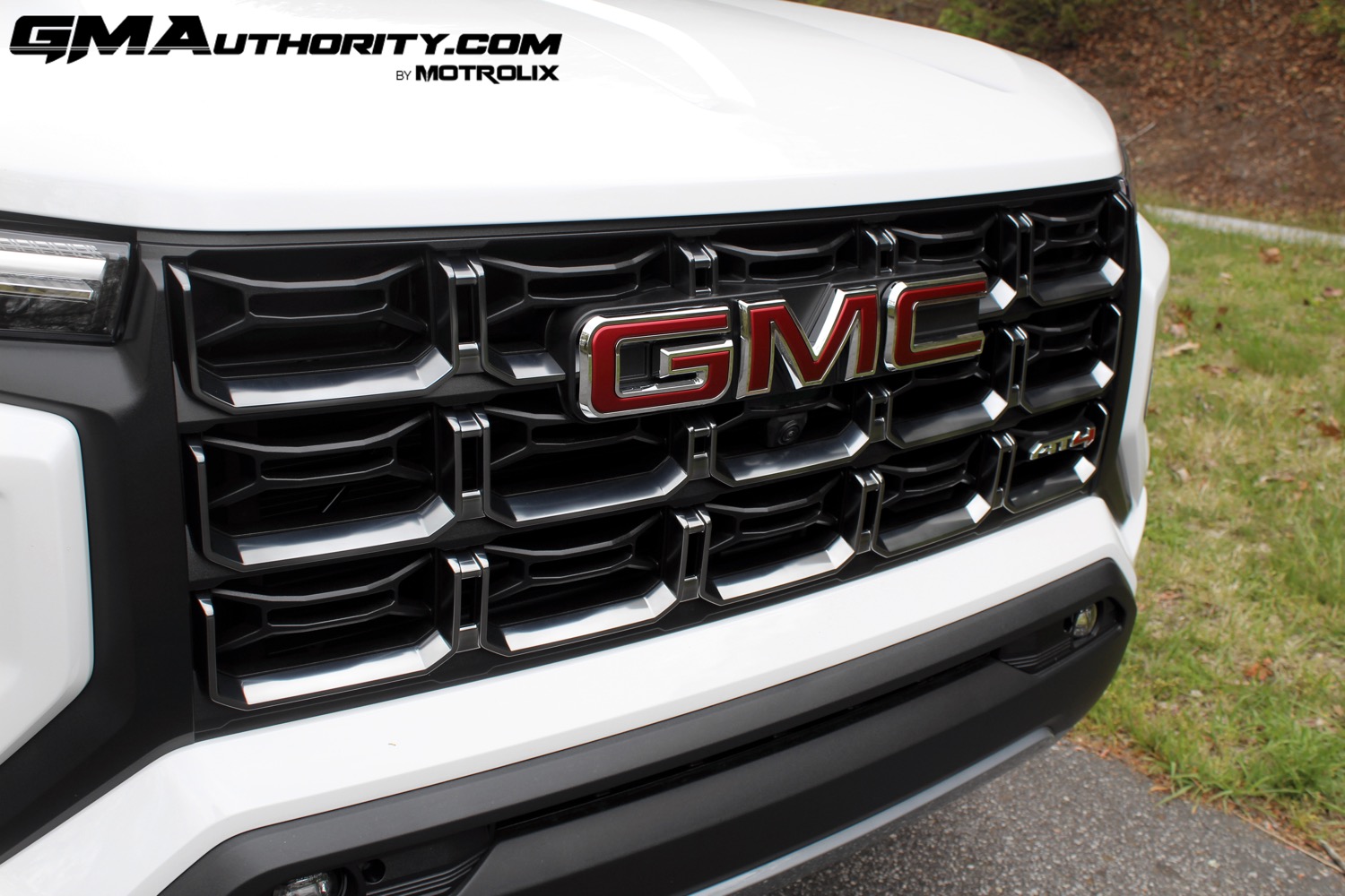 2023-gmc-canyon-at4-summit-white-gaz-first-drive-exterior-020-gmc-logo-badge-on-grille