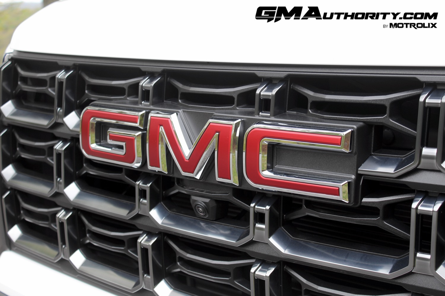 2023-gmc-canyon-at4-summit-white-gaz-first-drive-exterior-024-gmc-logo-badge-on-grille