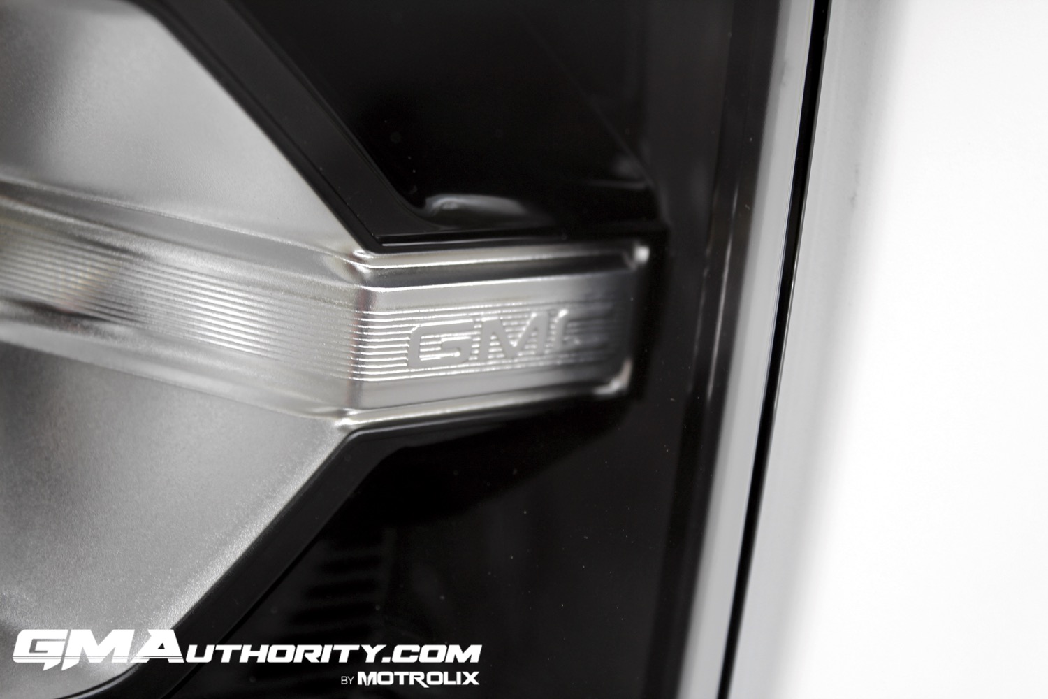 2023-gmc-canyon-at4-summit-white-gaz-first-drive-exterior-029-gmc-logo-in-headlight-cluster