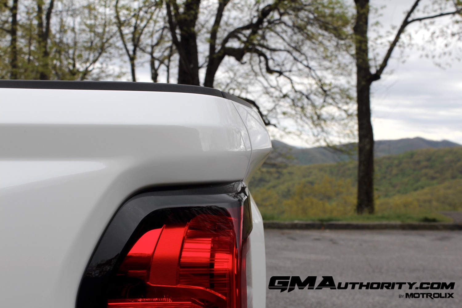 2023-gmc-canyon-at4-summit-white-gaz-first-drive-exterior-057-tailgate-lip-tail-light