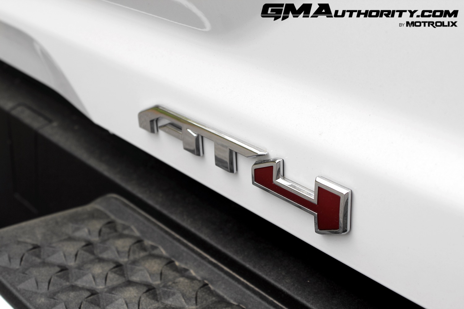 2023-gmc-canyon-at4-summit-white-gaz-first-drive-exterior-071-at4-logo-badge-on-tailgate