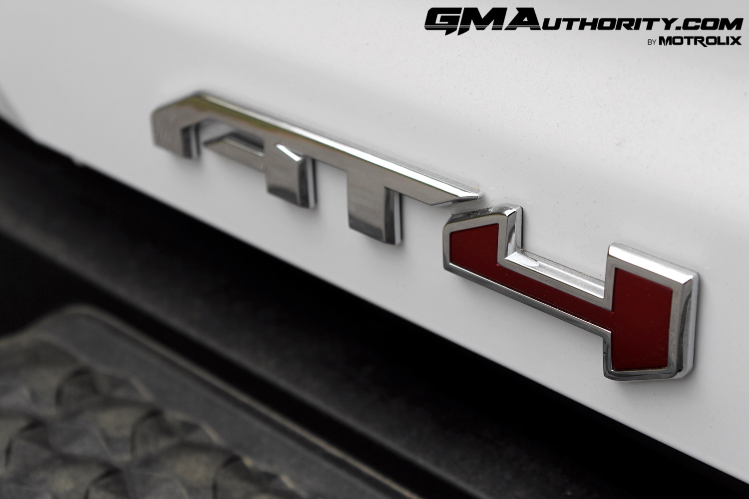 2023-gmc-canyon-at4-summit-white-gaz-first-drive-exterior-072-at4-logo-badge-on-tailgate