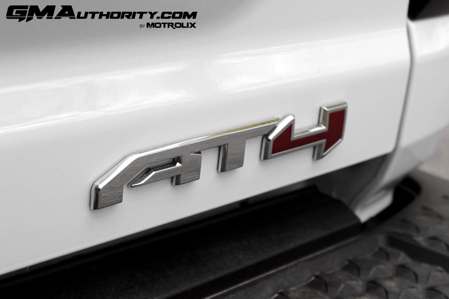 2023-gmc-canyon-at4-summit-white-gaz-first-drive-exterior-074-at4-logo-badge-on-tailgate