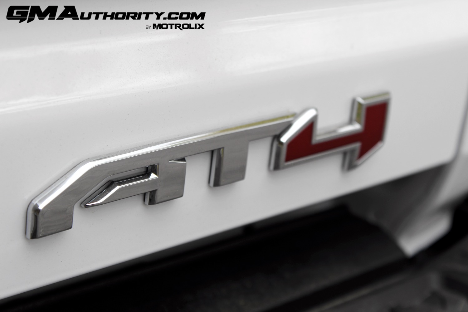 2023-gmc-canyon-at4-summit-white-gaz-first-drive-exterior-075-at4-logo-badge-on-tailgate