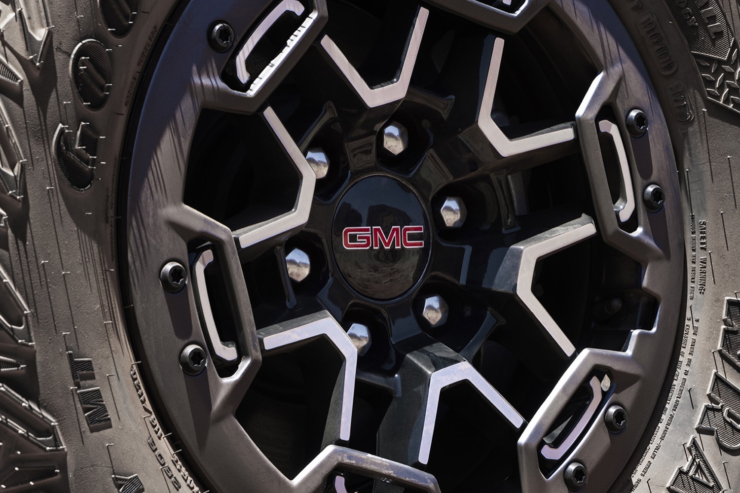 2023-gmc-canyon-at4x-exterior-013-wheel-center-cap-gmc-logo-lug-nuts