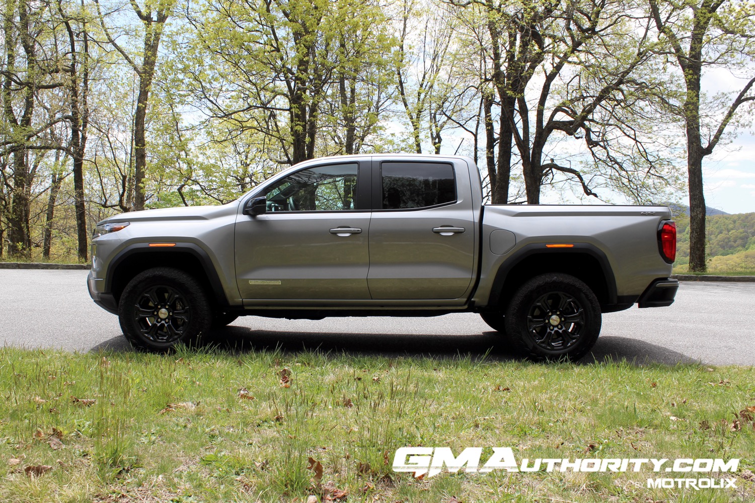 2023-gmc-canyon-elevation-sterling-metallic-gxd-first-drive-exterior-016-side