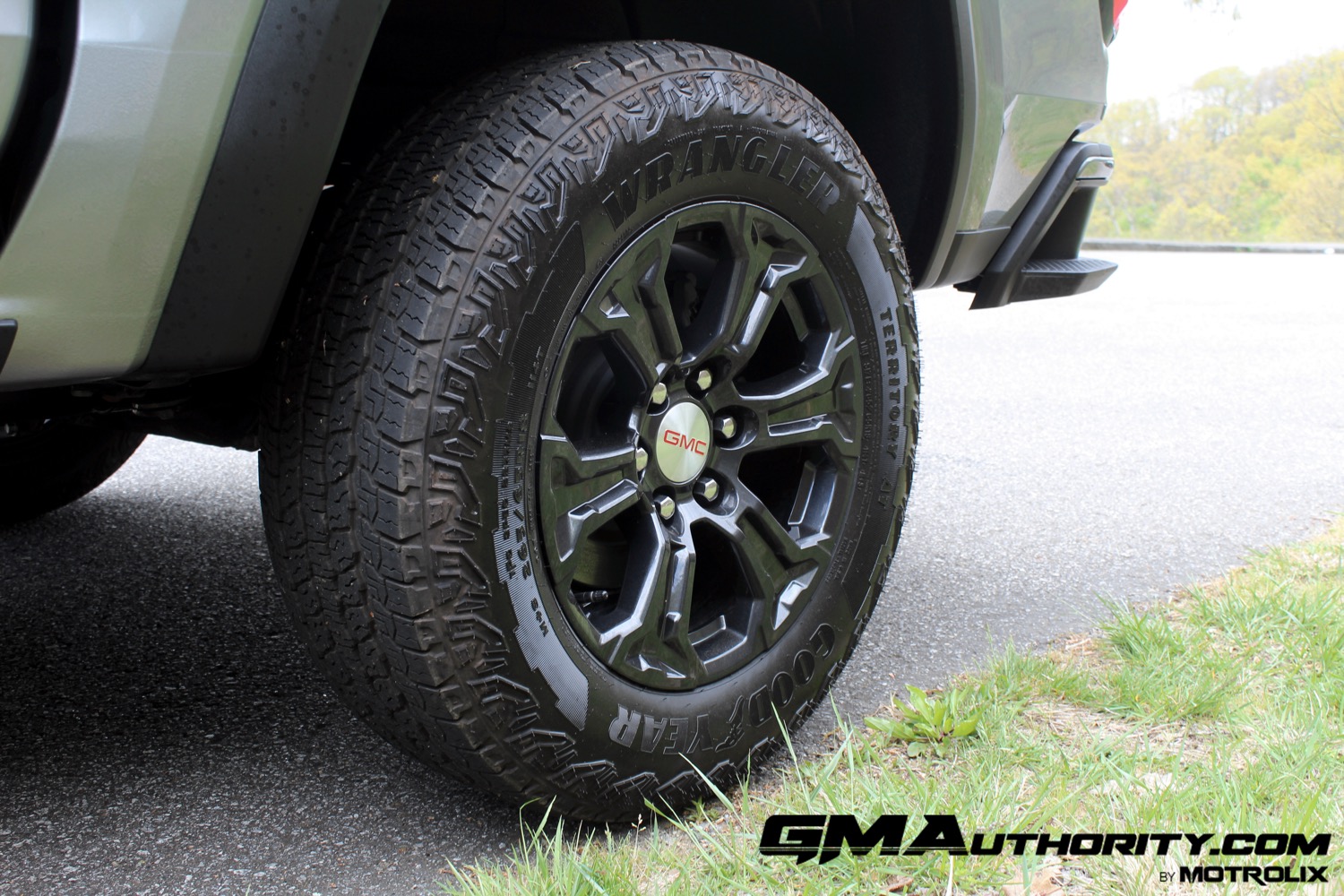 2023-gmc-canyon-elevation-sterling-metallic-gxd-first-drive-exterior-019-goodyear-wrangler-territory-at-all-terrain-tire-18-inch-gloss-black-wheel