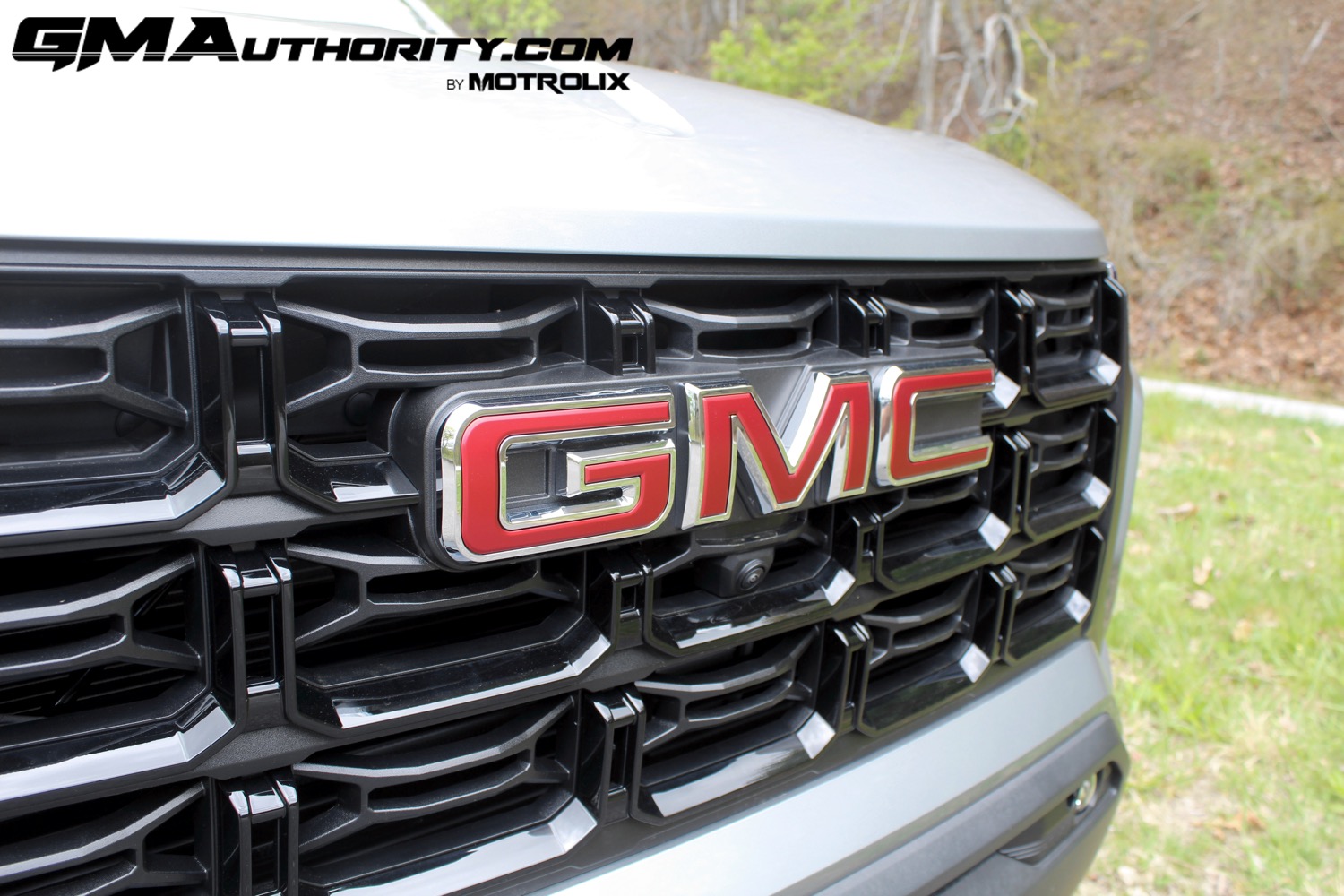 2023-gmc-canyon-elevation-sterling-metallic-gxd-first-drive-exterior-031-gmc-logo-badge-on-grille