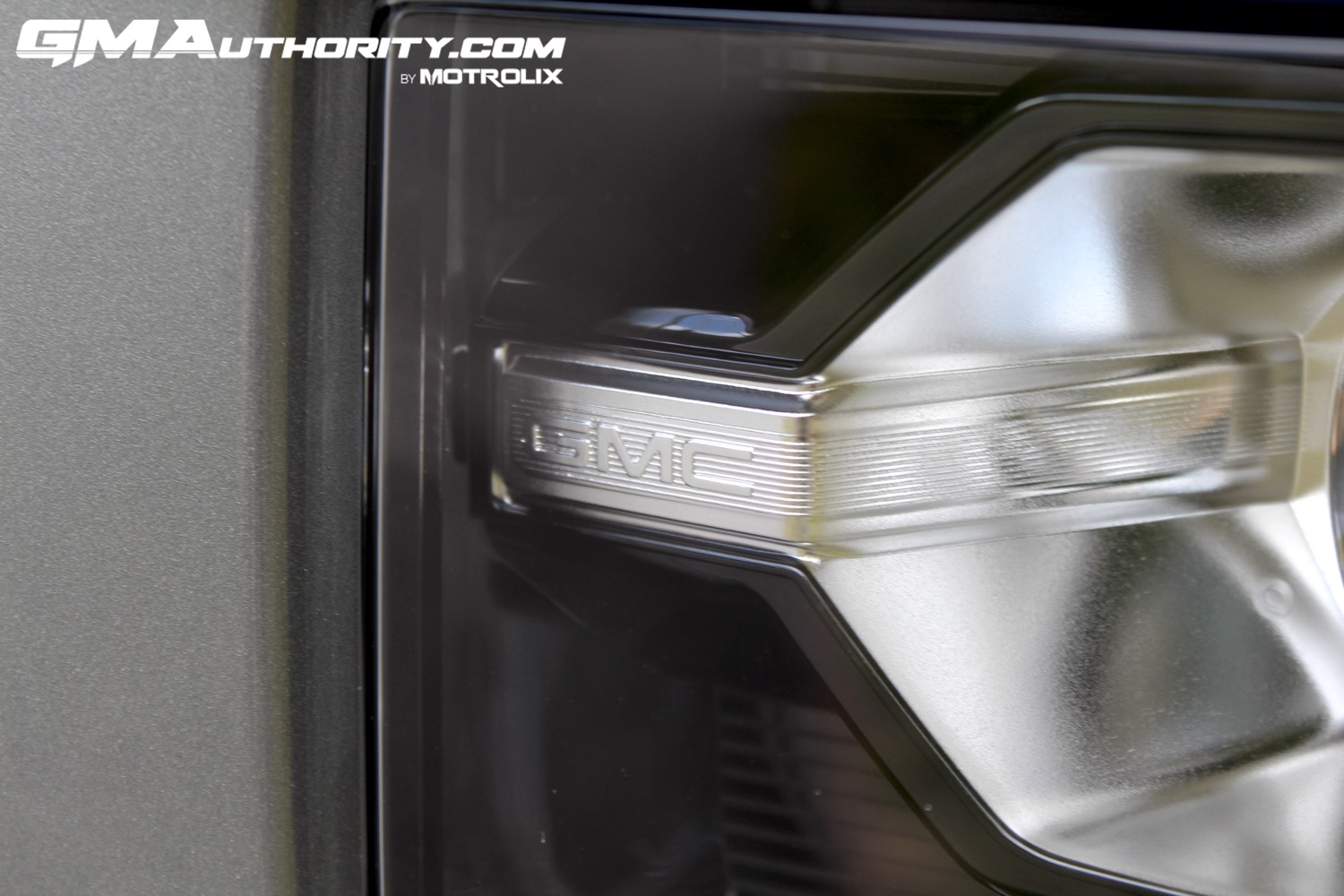 2023-gmc-canyon-elevation-sterling-metallic-gxd-first-drive-exterior-033-gmc-logo-in-headlight