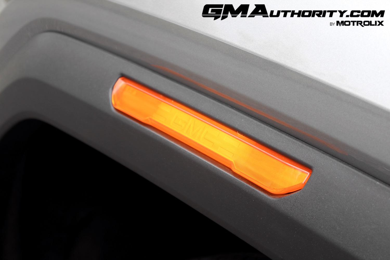 2023-gmc-canyon-elevation-sterling-metallic-gxd-first-drive-exterior-043-gmc-logo-in-marker-light