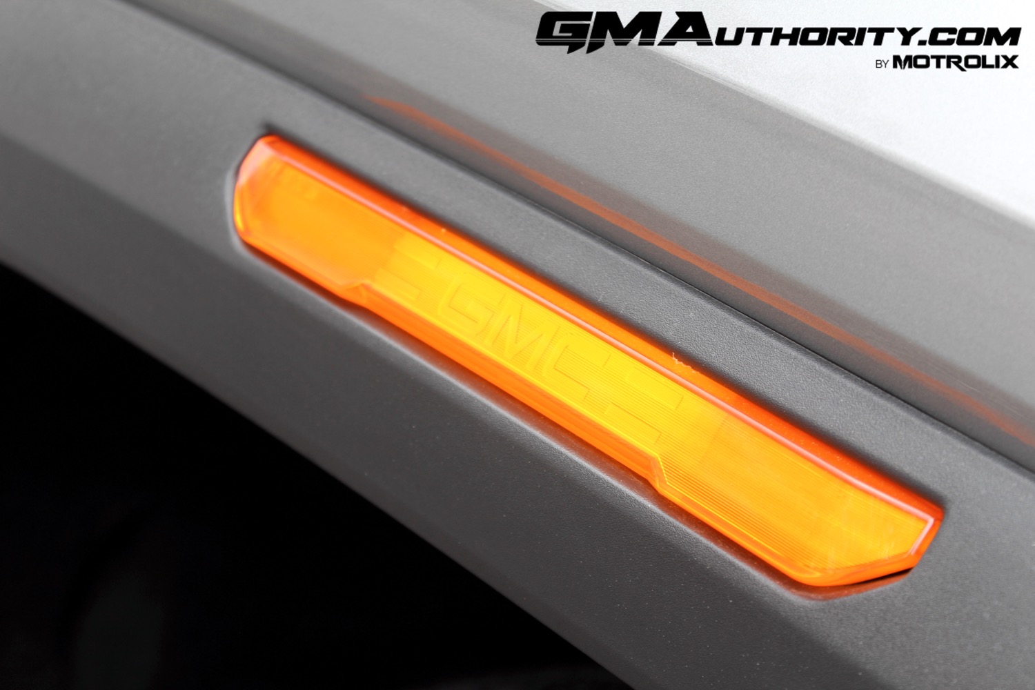 2023-gmc-canyon-elevation-sterling-metallic-gxd-first-drive-exterior-044-gmc-logo-in-marker-light