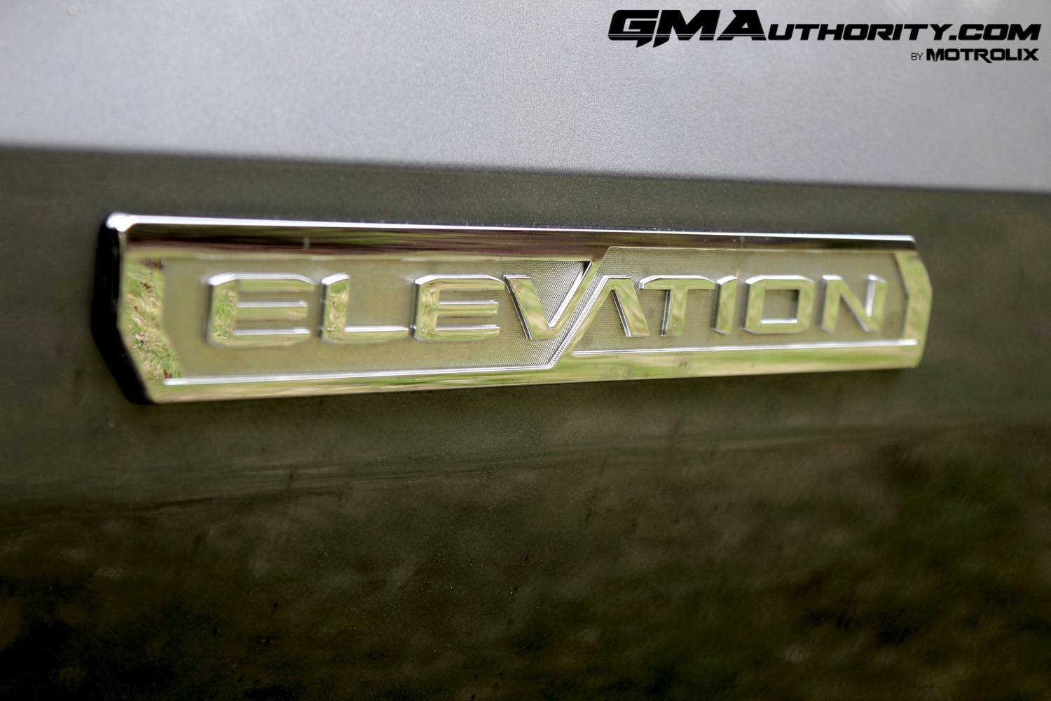 2023-gmc-canyon-elevation-sterling-metallic-gxd-first-drive-exterior-049-elevation-logo-badge-on-door