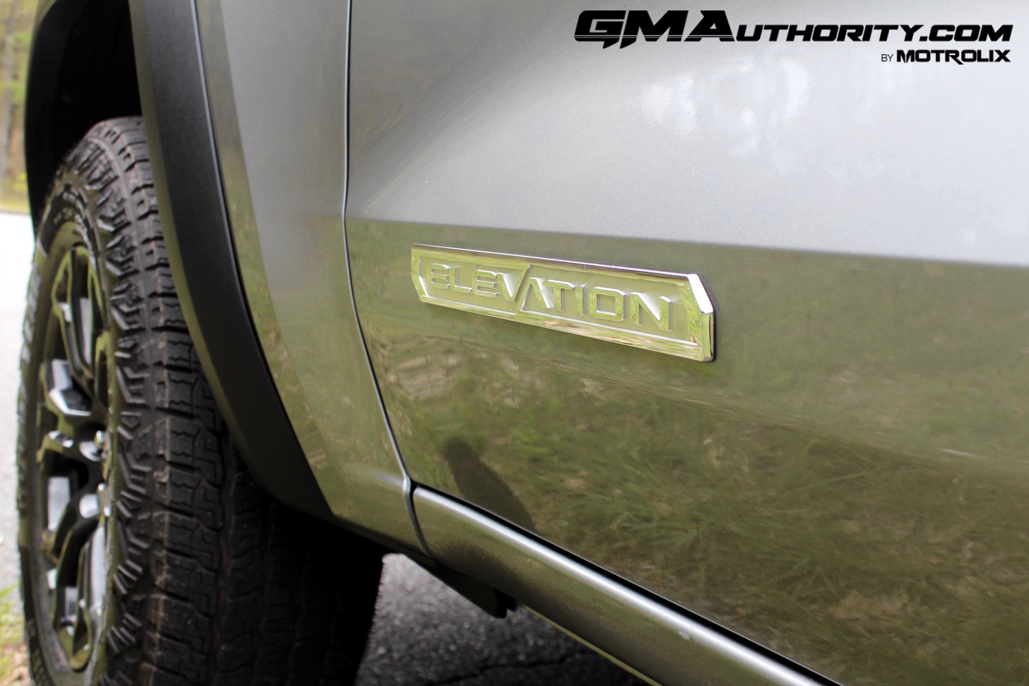 2023-gmc-canyon-elevation-sterling-metallic-gxd-first-drive-exterior-050-elevation-logo-badge-on-door