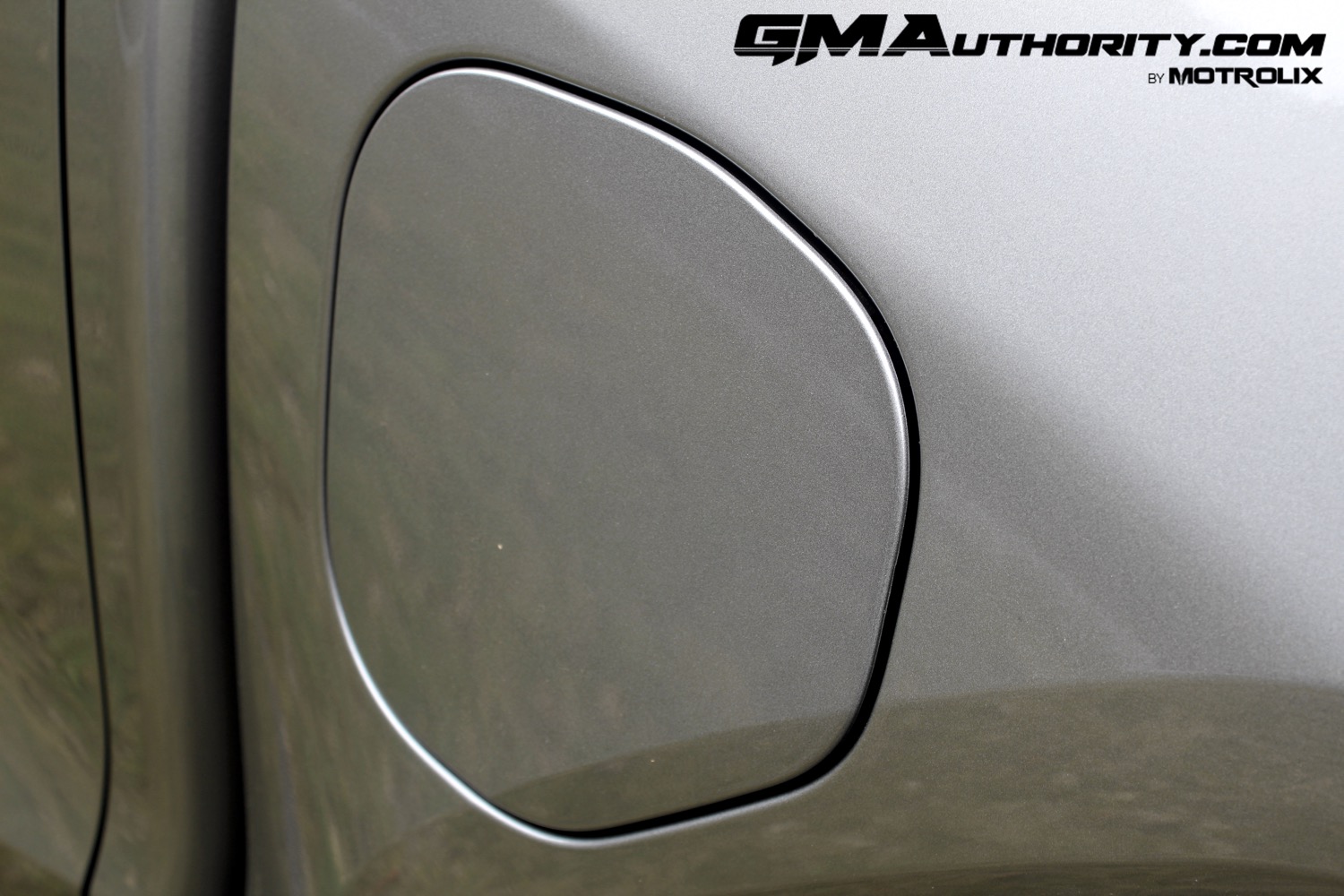 2023-gmc-canyon-elevation-sterling-metallic-gxd-first-drive-exterior-056-fuel-door-cover