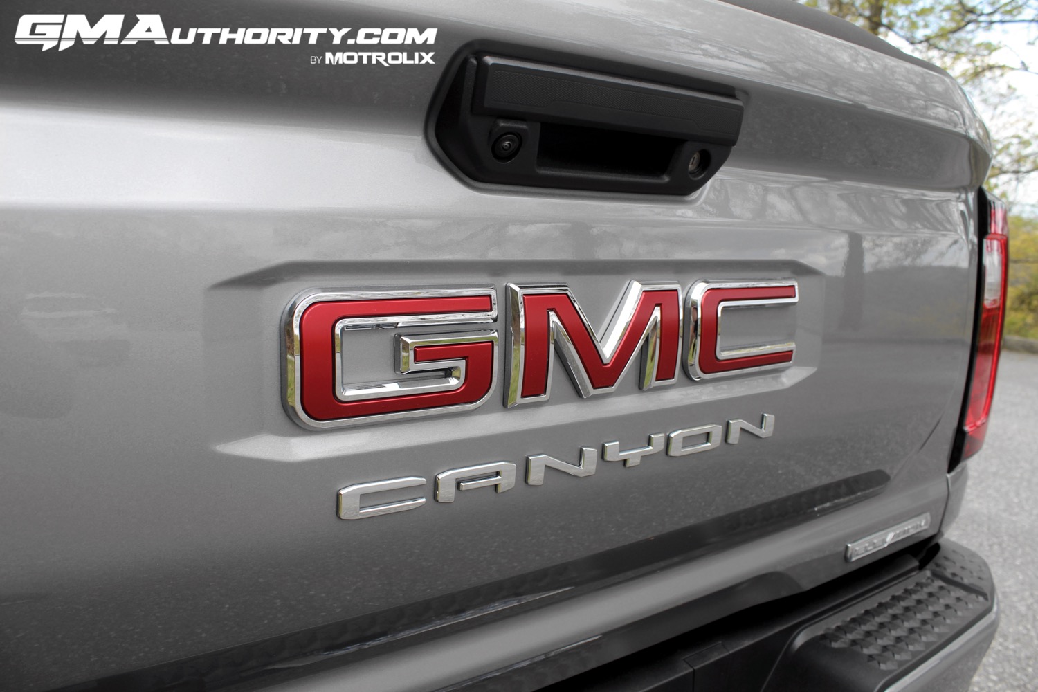 2023-gmc-canyon-elevation-sterling-metallic-gxd-first-drive-exterior-071-gmc-logo-badge-on-tailgate