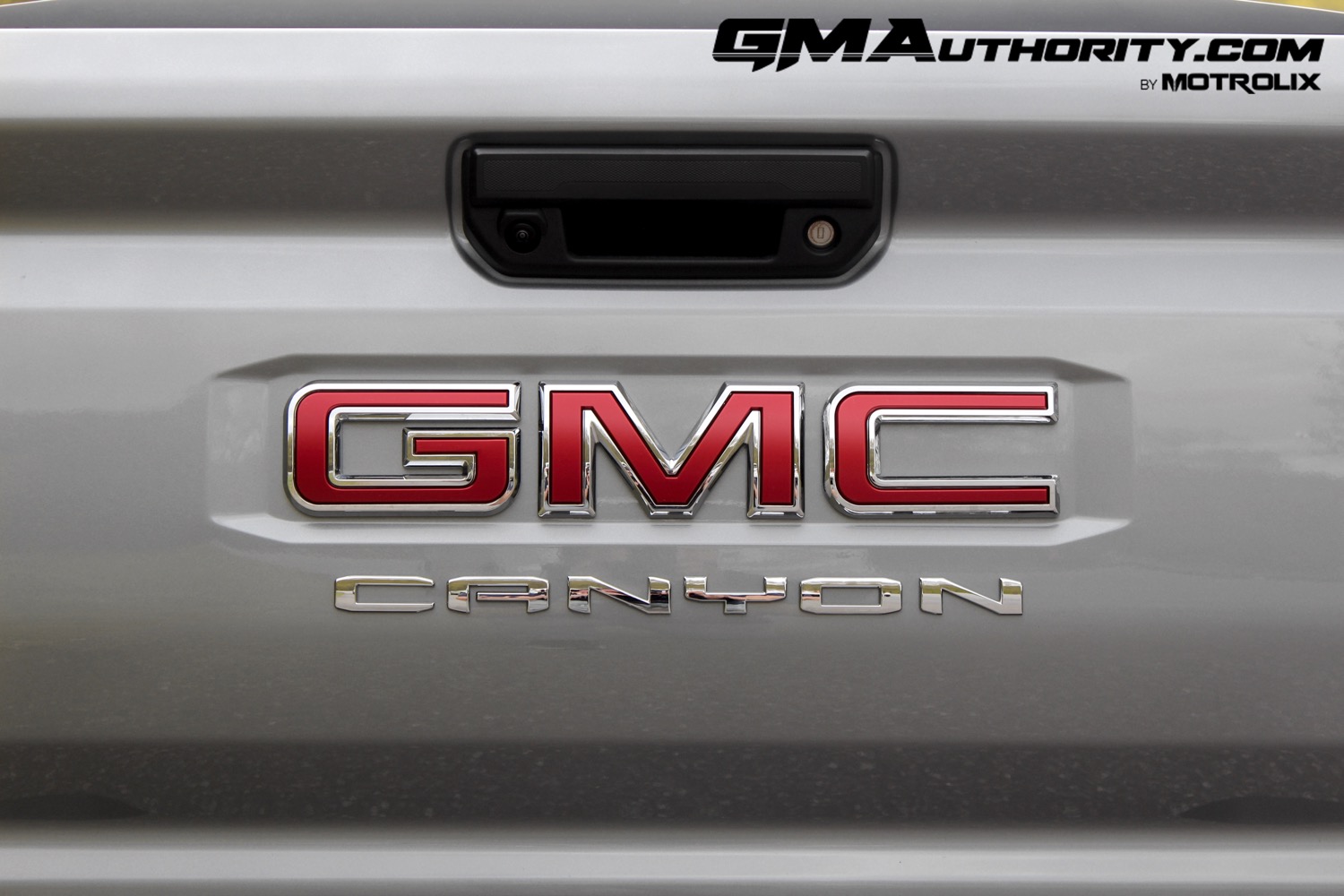 2023-gmc-canyon-elevation-sterling-metallic-gxd-first-drive-exterior-075-gmc-canyon-logo-badge-on-tailgate