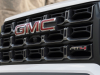 2023-gmc-canyon-at4-exterior-009-grille-gmc-logo-at4-logo-front-camera