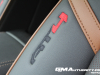 2023-gmc-canyon-at4-jet-black-with-timber-hx6-first-drive-interior-011-embroidered-at4-logo-on-front-seat-bolster