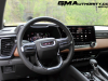 2023-gmc-canyon-at4-jet-black-with-timber-hx6-first-drive-interior-013-cockpit-digital-instrument-panel-gauge-cluster-infotainment-display-screen-center-stack-center-console