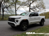 2023-gmc-canyon-at4-summit-white-gaz-first-drive-exterior-005-side-front-three-quarters