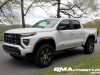 2023-gmc-canyon-at4-summit-white-gaz-first-drive-exterior-006-side-front-three-quarters