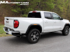 2023-gmc-canyon-at4-summit-white-gaz-first-drive-exterior-016-side-rear-three-quarters