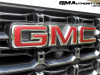 2023-gmc-canyon-at4-summit-white-gaz-first-drive-exterior-021-gmc-logo-badge-on-grille