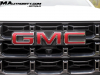 2023-gmc-canyon-at4-summit-white-gaz-first-drive-exterior-022-gmc-logo-badge-on-grille