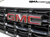 2023-gmc-canyon-at4-summit-white-gaz-first-drive-exterior-024-gmc-logo-badge-on-grille