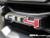 2023-gmc-canyon-at4-summit-white-gaz-first-drive-exterior-035-at4-logo-badge-on-grille