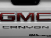 2023-gmc-canyon-at4-summit-white-gaz-first-drive-exterior-068-gmc-canyon-logo-badge-on-tailgate