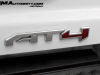 2023-gmc-canyon-at4-summit-white-gaz-first-drive-exterior-073-at4-logo-badge-on-tailgate