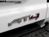 2023-gmc-canyon-at4-summit-white-gaz-first-drive-exterior-074-at4-logo-badge-on-tailgate