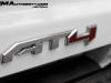 2023-gmc-canyon-at4-summit-white-gaz-first-drive-exterior-075-at4-logo-badge-on-tailgate