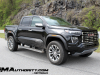 2023-gmc-canyon-denali-onyx-black-gba-first-drive-exterior-006-side-front-three-quarters