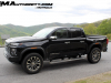 2023-gmc-canyon-denali-onyx-black-gba-first-drive-exterior-023-side-front-three-quarters