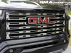 2023-gmc-canyon-denali-onyx-black-gba-first-drive-exterior-026-gmc-logo-badge-on-grille