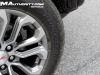 2023-gmc-canyon-denali-onyx-black-gba-first-drive-exterior-048-bridgestone-dueler-at-all-terrain-tire-20-inch-diamond-cut-dark-grey-aluminum-wheel-rd4