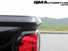 2023-gmc-canyon-denali-onyx-black-gba-first-drive-exterior-066-bedside-tailgate-tailgate-spoiler