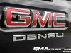 2023-gmc-canyon-denali-onyx-black-gba-first-drive-exterior-069-gmc-denali-logo-badge-on-tailgate