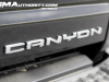 2023-gmc-canyon-denali-onyx-black-gba-first-drive-exterior-071-canyon-logo-badge-on-tailgate