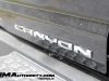 2023-gmc-canyon-denali-onyx-black-gba-first-drive-exterior-072-canyon-logo-badge-on-tailgate