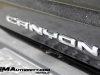 2023-gmc-canyon-denali-onyx-black-gba-first-drive-exterior-073-canyon-logo-badge-on-tailgate