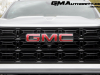 2023-gmc-canyon-elevation-sterling-metallic-gxd-first-drive-exterior-028-gmc-logo-badge-on-grille