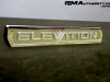 2023-gmc-canyon-elevation-sterling-metallic-gxd-first-drive-exterior-049-elevation-logo-badge-on-door