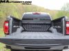 2023-gmc-canyon-elevation-sterling-metallic-gxd-first-drive-exterior-085-tailgate-open-mountain-graphic