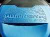 2024-gmc-hummer-ev-3x-suv-omega-edition-neptune-blue-matte-press-photos-exterior-004-hummer-ev-debossed-on-spare-tire-cover