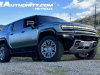 2024-gmc-hummer-ev-suv-3x-edition-1-moonshot-green-matte-g7w-first-drive-exterior-010-side-front-three-quarters